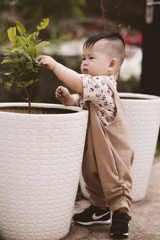 toddler boy gardening