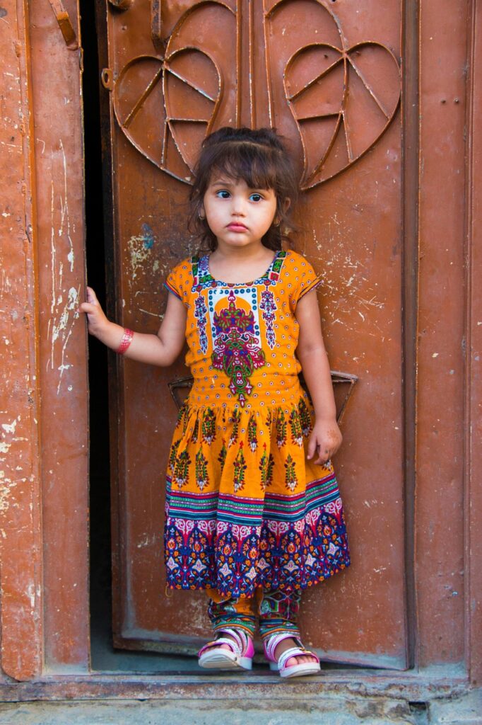 girl standing in ornate doorway facing her fear