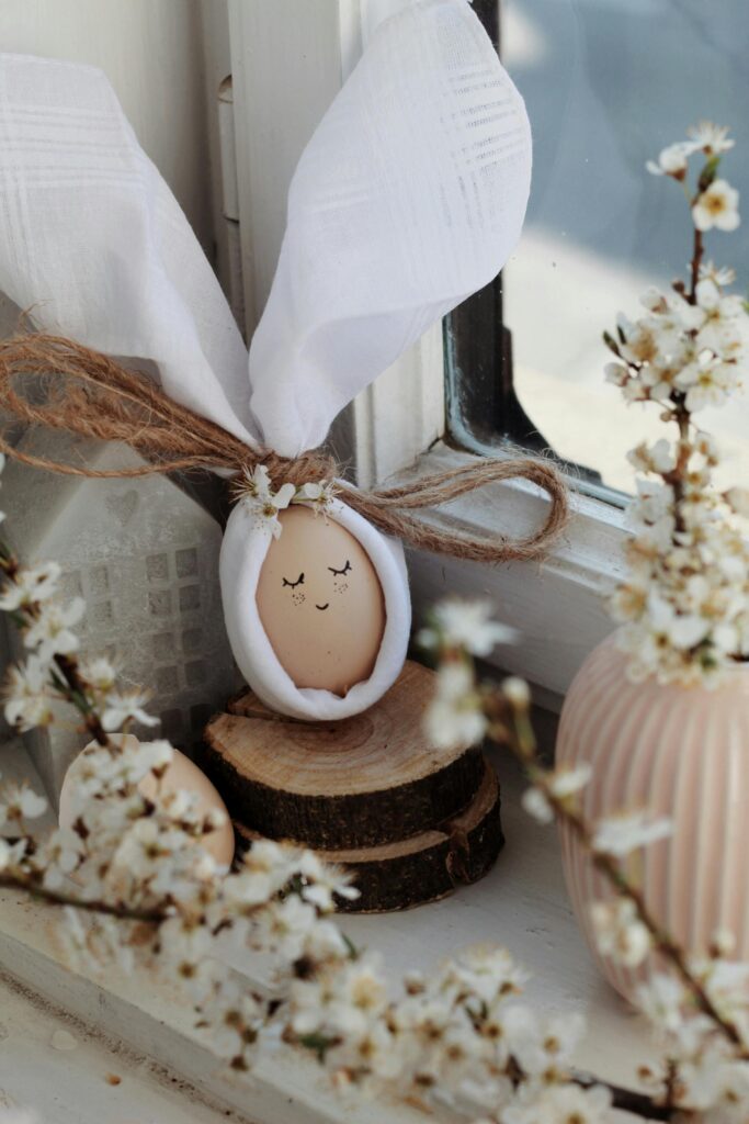 a cute egg wrapped in a white cloth to form bunny ears