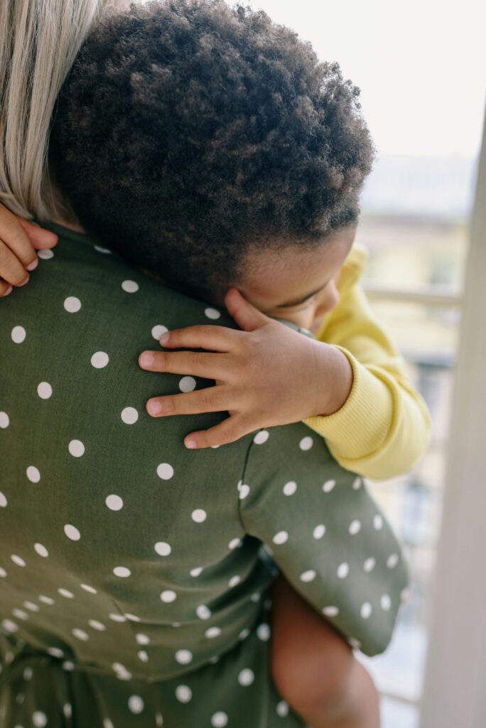 child hugging his mom after facing his fear