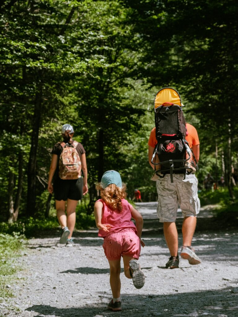 mom and dad hiking with child