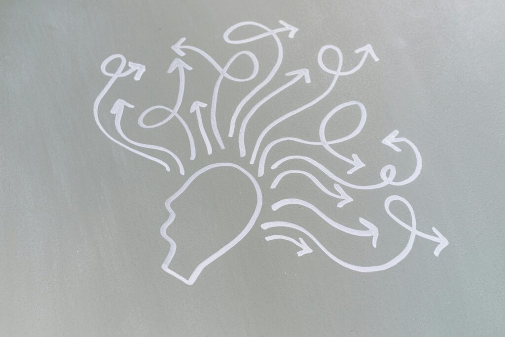 illustration of arrows around a head showing overloaded mind