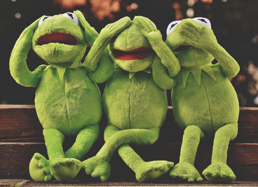 Three Kermits sitting together in see no evil hear no evil and speak no evil to illustrate the frustration of cleaning with kids